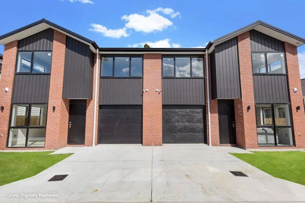 Old Wairoa Road townhouses — brick and dark cladding